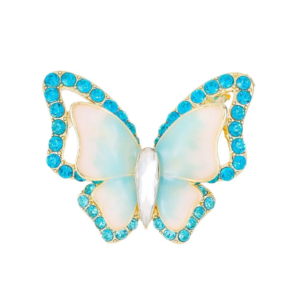 Schmetterling Brosche mit blauen Kristallen und goldfarbenem Rand, funkelnder Damenschmuck
